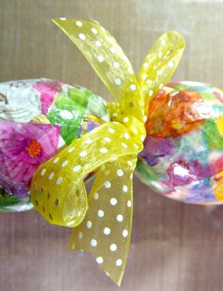 Sheer ribbon tied between glued eggs Sheer ribbon tied between glued eggs