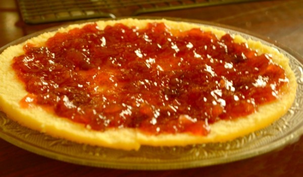 Spreading jam on the sponge cake Spreading jam on the sponge cake