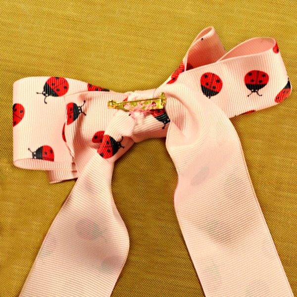 With a ready-made tote, some buttons, ribbon & crystals, it's easy to make a cute Ladybug Button & Bling Tote! At littlemisscelebration.com