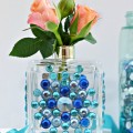 Don't toss that empty perfume bottle! With some gems & glue, upcycle it into a pretty bud vase that double as a decorative piece, too! At littlemisscelebration.com