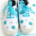 Ready-made flowers, fabric glue & ribbon laces make easy, prettied-up sneakers! At littlemisscelebration.com