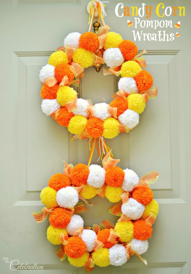 Bright, fluffy and Halloween-happy, Candy Corn Pompom Wreaths are candy-inspired holiday decor for doors or windows! At littlemisscelebration.com #crafts #halloween