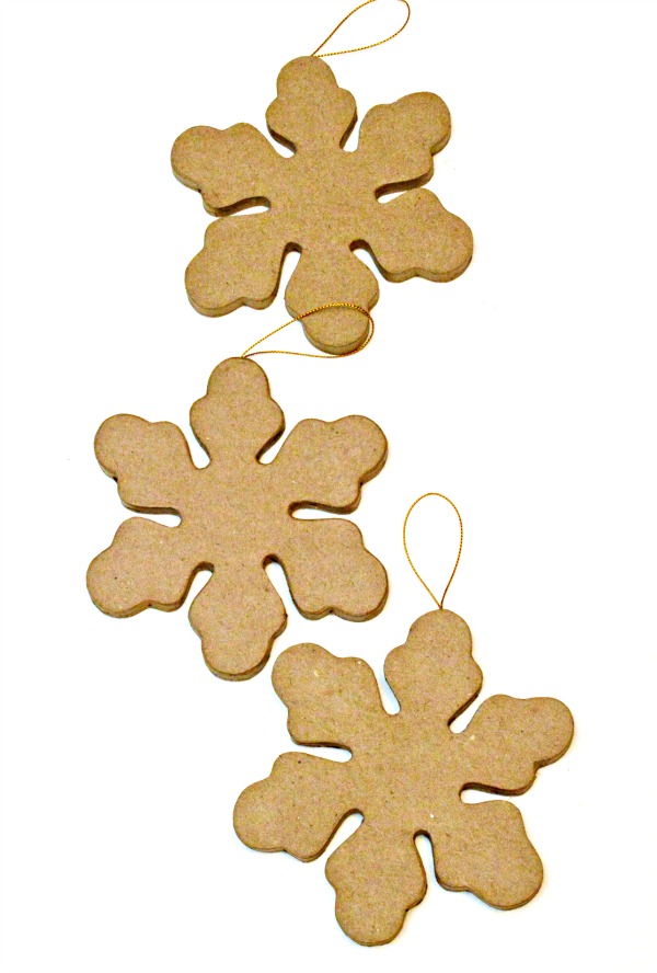 Add some holiday dazzle to Paper Mache Snowflake Ornaments! Pretty for the tree or as package toppers and can be used all winter. At littlemisscelebration.com #Christmas 