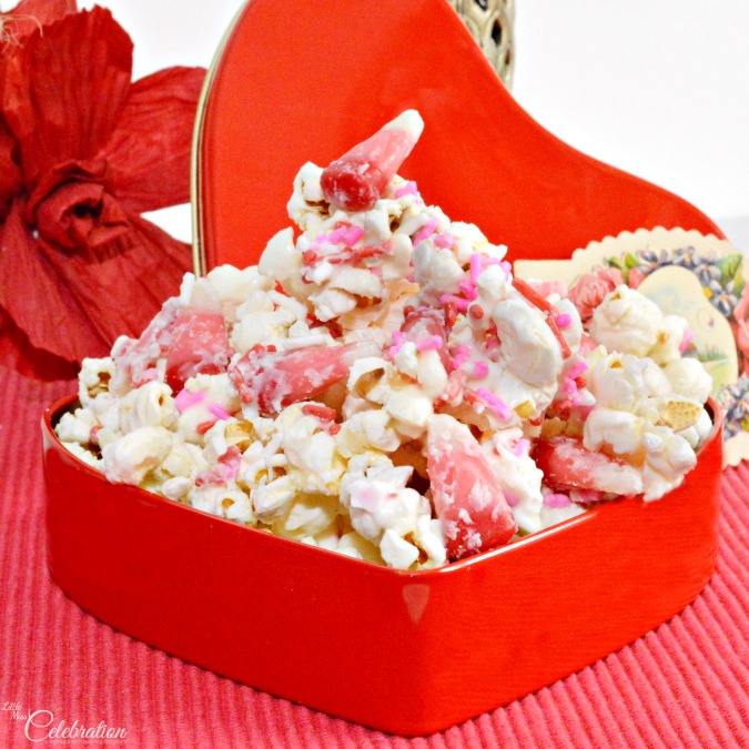 Next, melt about four to five tablespoons of butter, put over the popped corn, add salt and mix with a spatula. The butter and salt helps to build the flavor combinatio