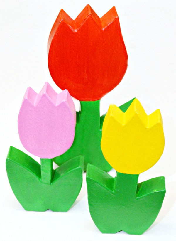 How CUTE are these forever tulips? It's easy to turn paper mache flowers into bright, sparkling charmers perfect for Mother's Day! at littlemisscelebration.com