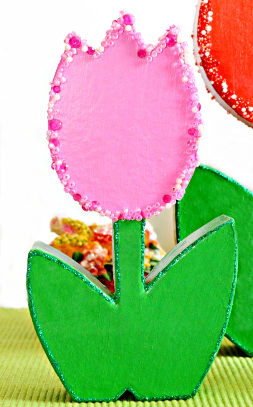 How CUTE are these forever tulips? It's easy to turn paper mache flowers into bright, sparkling charmers perfect for Mother's Day! at littlemisscelebration.com