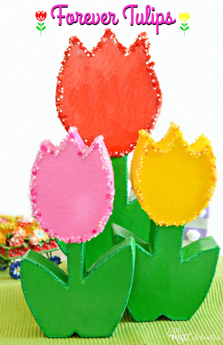 How CUTE are these forever tulips? It's easy to turn paper mache flowers into bright, sparkling charmers perfect for Mother's Day! at littlemisscelebration.com