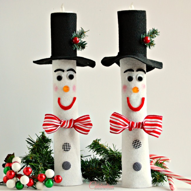 Wrapping Paper Roll Snowman Candles - a lot of charming, holiday impact for little $$. SO cute! 